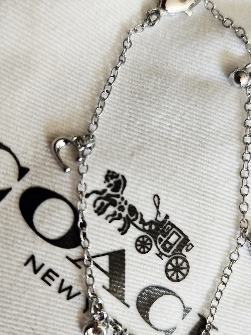 Coach Silver Charm Bracelet with Heart Accents